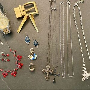 Mixed Men and Woman jewelry. Watch, necklaces, charms, tie pins, belt buckle.